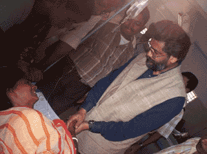 Comrade Dipankar with an injured woman at Nandigram